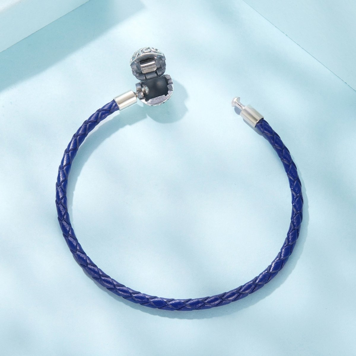 Liora Atelier Blue Swirl Clasp Leather Charm Bracelet