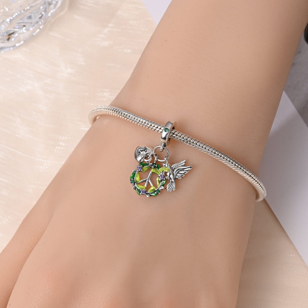 Liora Atelier Dove, Peace Wreath, and Love Heart Triple Dangle Charm