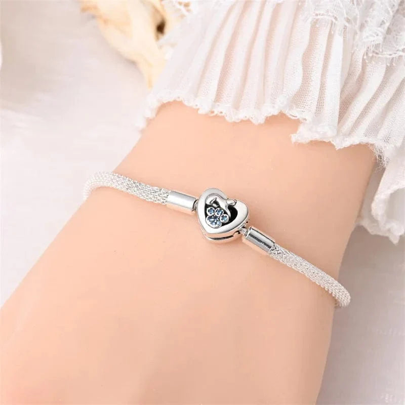 Liora Atelier Elegant Heart Clasp Bracelet with Blue Paw Gemstones