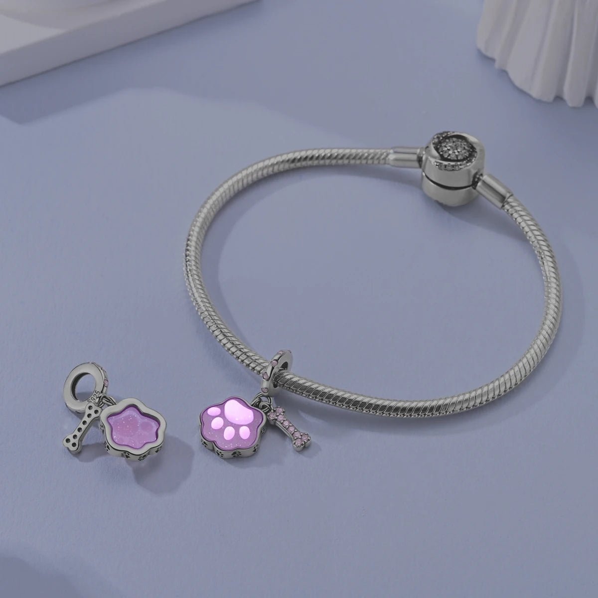 Liora Atelier Glow in the Dark Luminous Pink Paw & Bone Dangle Charm