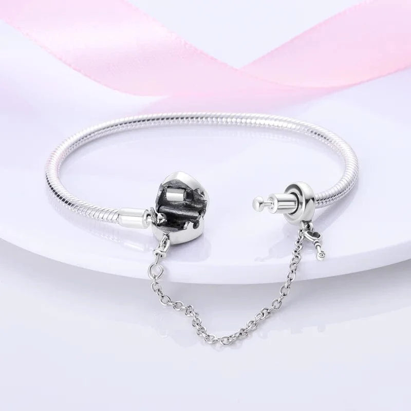 Liora Atelier Heart Lock Charm Bracelet with Pink Accents and Safety Chain
