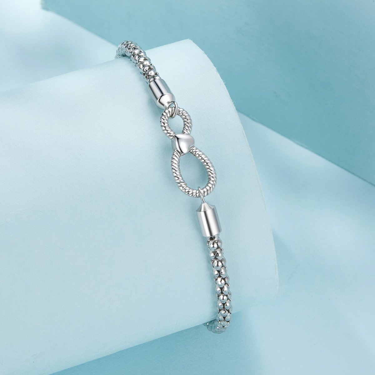 Liora Atelier Infinity Clasp Woven Charm Bracelet