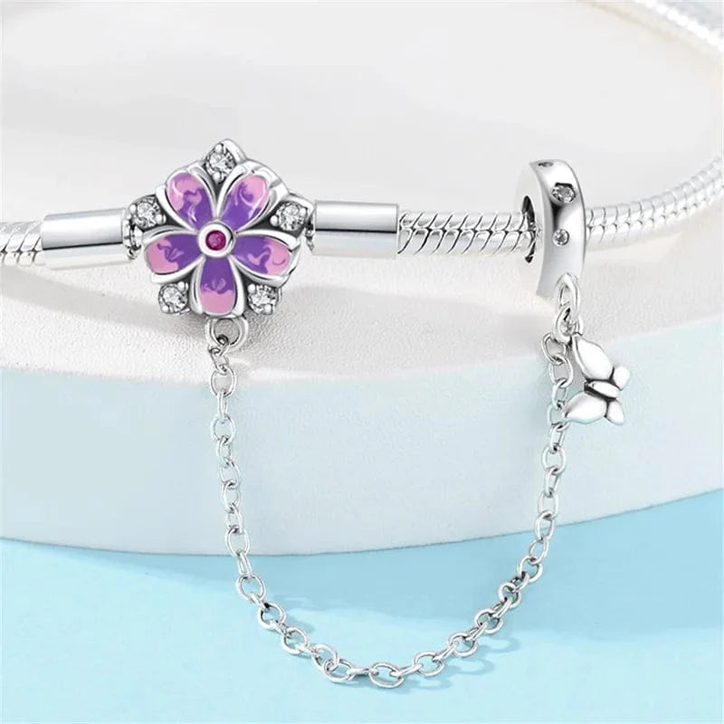 Liora Atelier Purple Flower Charm Bracelet with Butterfly Dangle and Safety Chain
