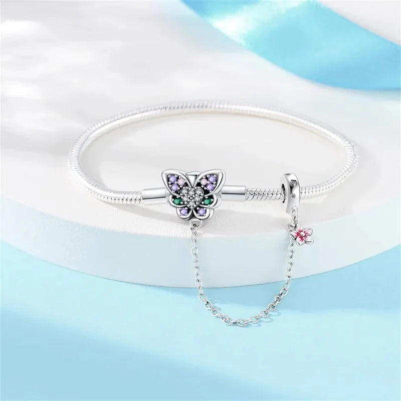Liora Atelier Butterfly Charm Bracelet with Crystal Accents and Flower Dangle