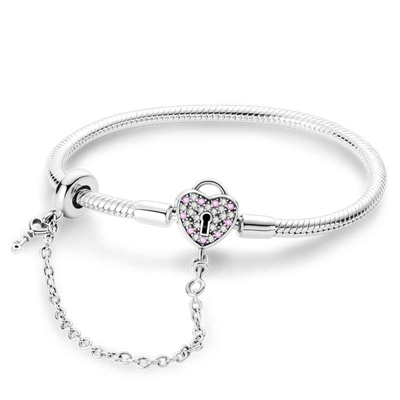 Liora Atelier Heart Lock Charm Bracelet with Pink Accents and Safety Chain