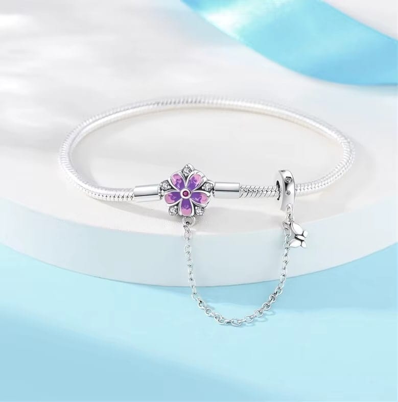 Liora Atelier Purple Flower Charm Bracelet with Butterfly Dangle and Safety Chain