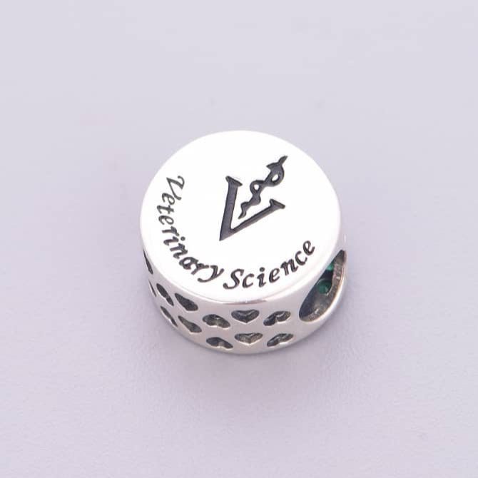 Liora Atelier Veterinary Science Symbol with Green Crystal Charm